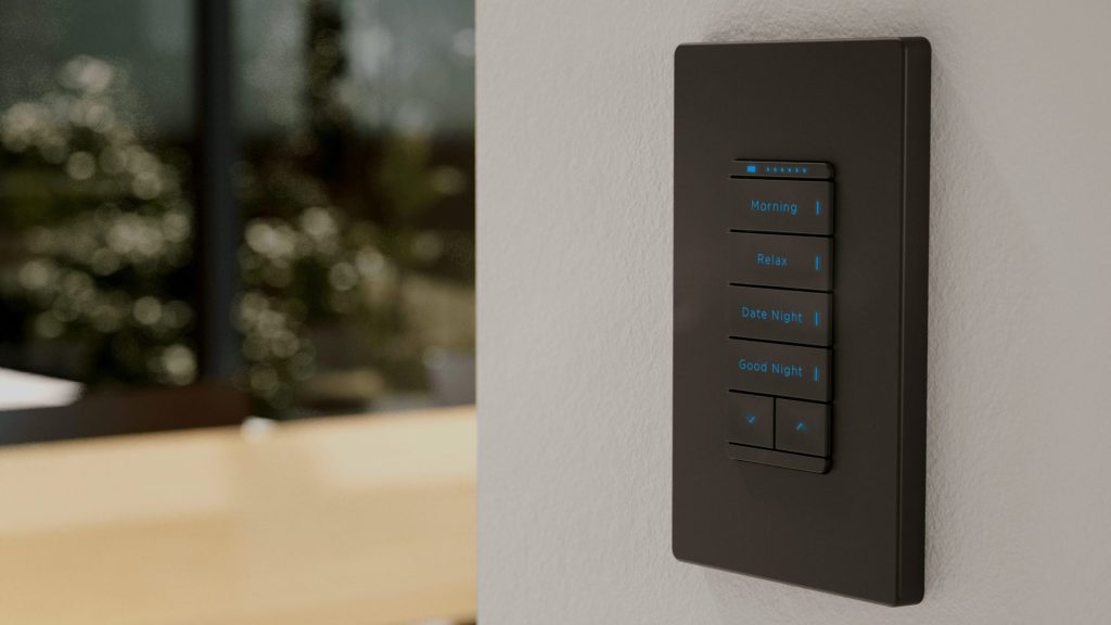 Savant Interfaces: #1 Intelligent Design 3 a black Savant Keypad with blue lights